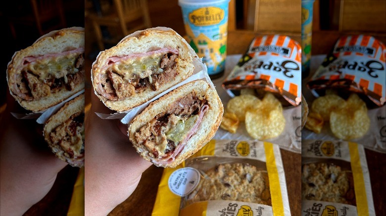 person holding Potbelly Cubano sandwich