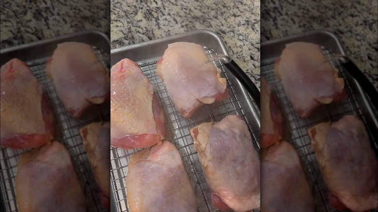 Pouring boiling water over chicken skin