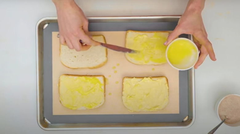 Spreading butter on bread