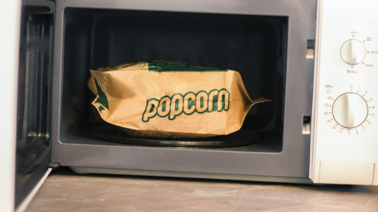 popped popcorn bag in microwave