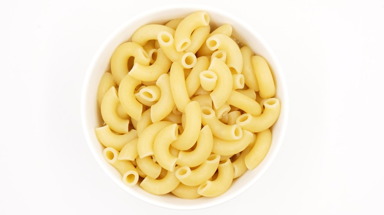 Cooked macaroni noodles in white dish