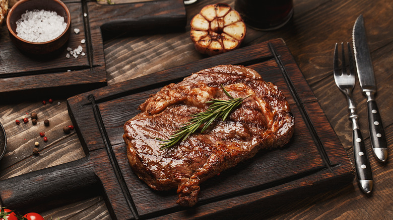 Ribeye steak with roasted garlic and rosemary