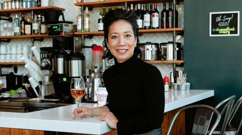 Chef Mary Nguyen leaning on bar