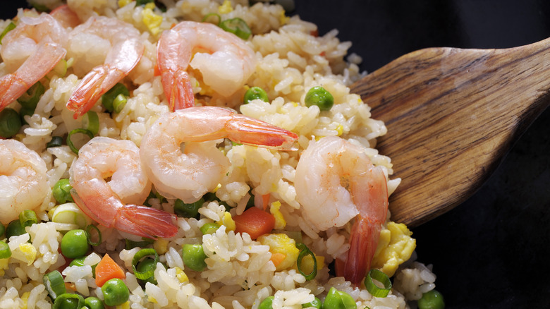 Shrimp fried rice being plated