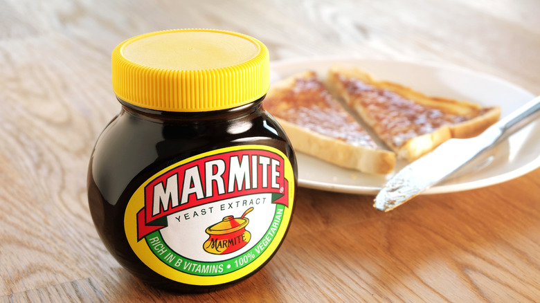 Marmite jar and spread on toast.