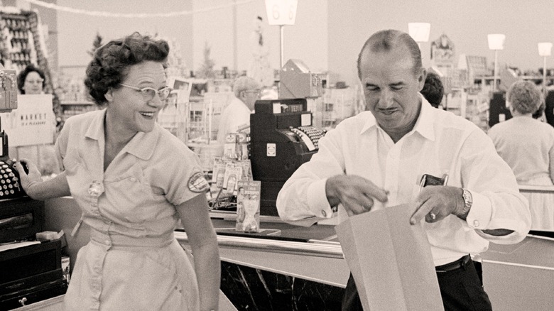 George Jenkins bagging groceries