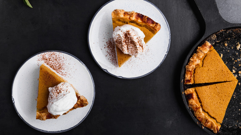 Pumpkin pie slices on plates