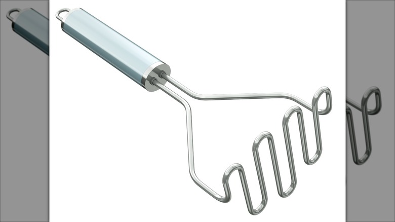 Potato masher against white background