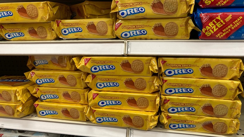 Packages of pumpkin spice Oreos on a grocery store shelf