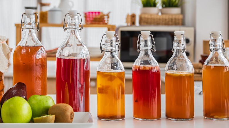 Swing top bottles of vinegar with fruit