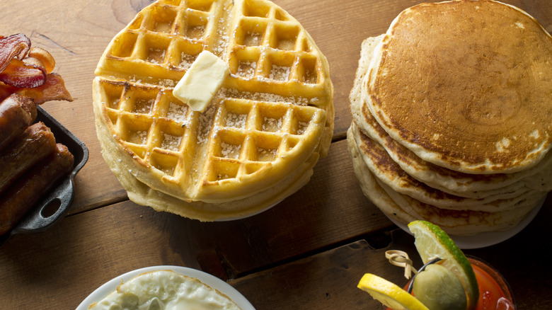 Waffles with butter and pancake stack