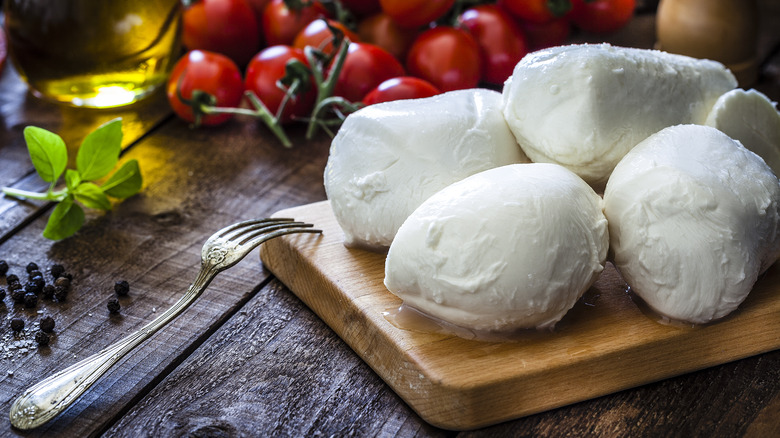 mozzarella cheese on cutting board