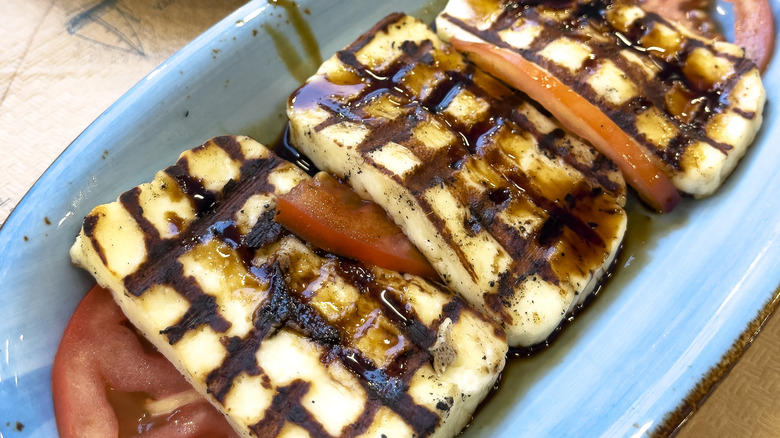 cooked halloumi on tomatoes