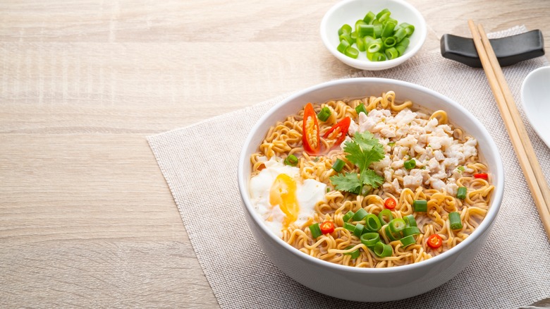 Bowl of ramen with toppings on placemat