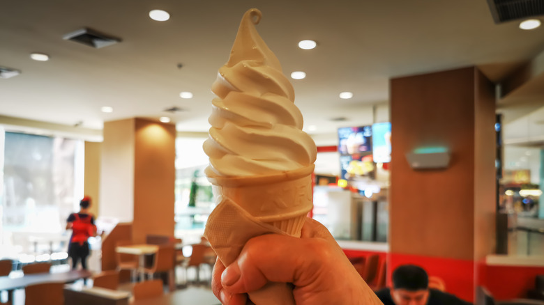 Hand holding soft serve cone