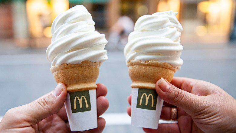 Hands holding McDonald's soft serve