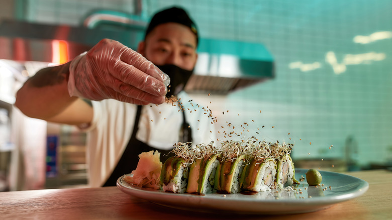 chef preparing sushi