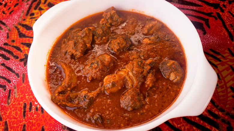 Red stew with meat in pot