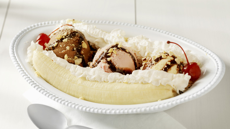 Banana split with ice cream on a plate