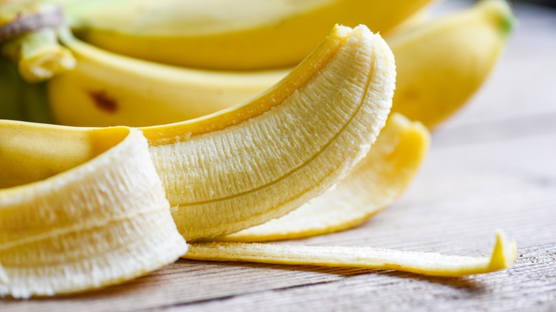 Peeled banana on a bench up close