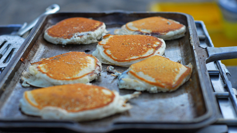 Pancakes cooking on a griddle