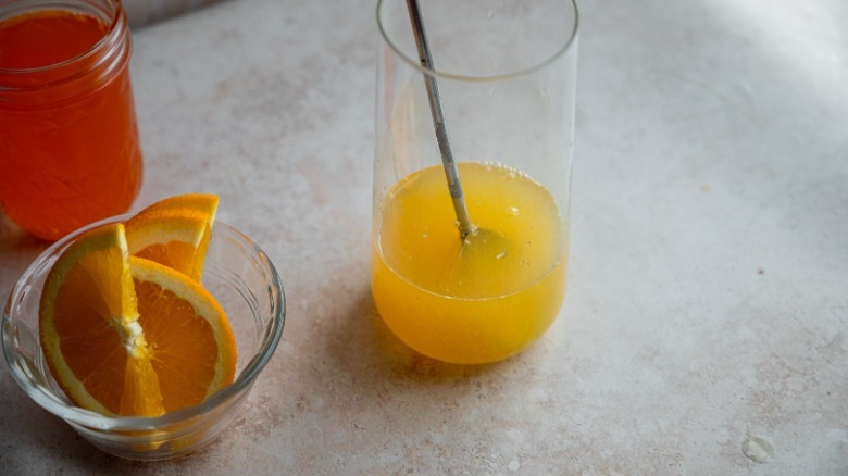 orange juice in tall glass