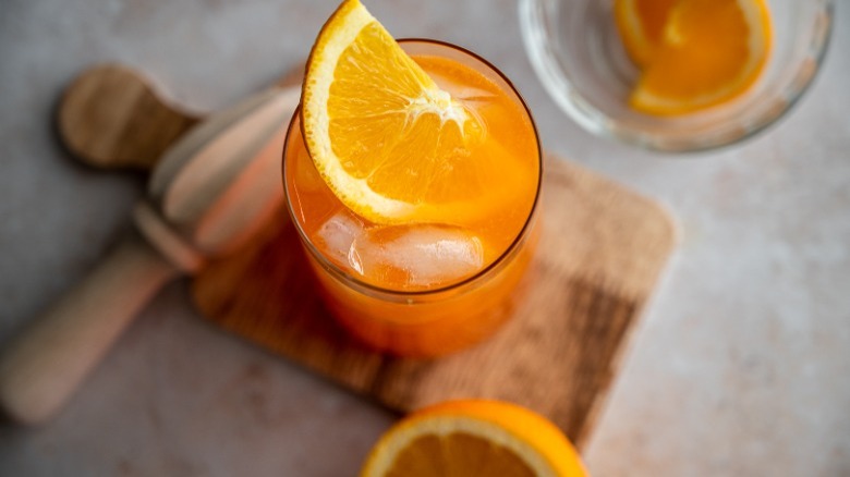 orange slice garnished on cocktail