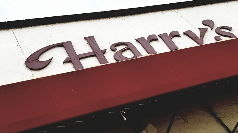 Harry's Cafe and Place sign