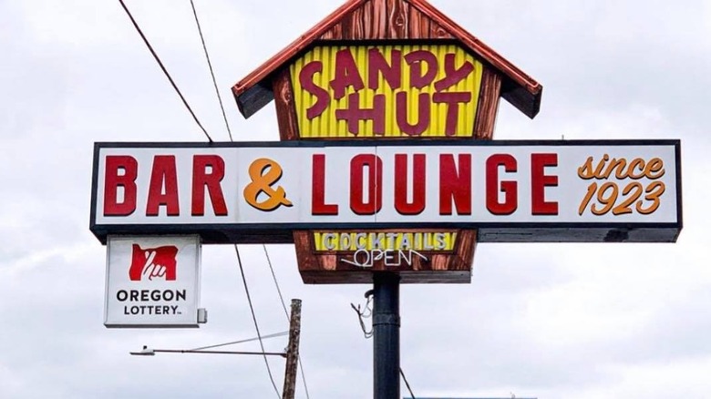 The Sandy Hut sign