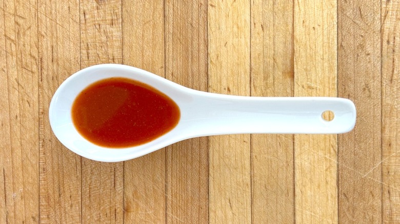 White spoonful of Cholula Extra Hot Sauce