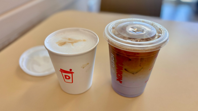 two Dunkin' coffee drinks on table