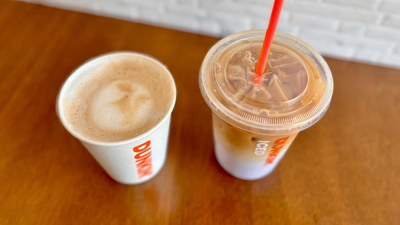 two Dunkin' coffees on table