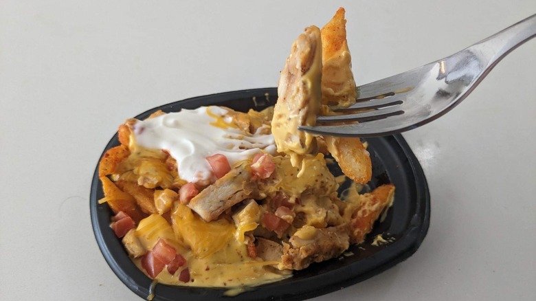 Yellowbird nacho fries on a fork