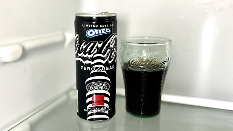 Coca-Cola can and glass