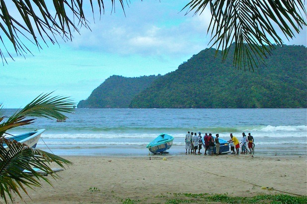 FIshermen bring a boat in from Maracas Bay.