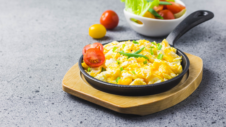 Creamy scrambled eggs in a skillet