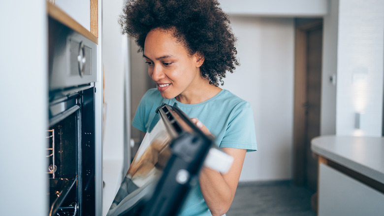 Person looking into oven