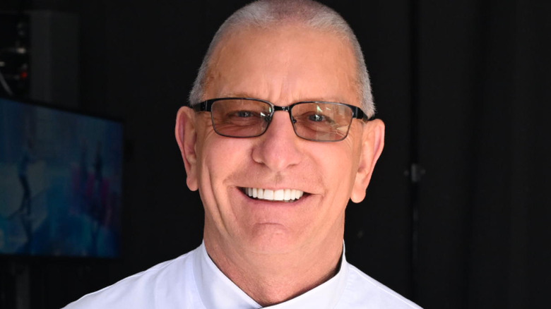 Robert Irvine smiles