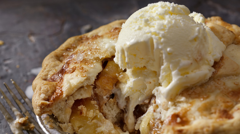 Fruit pie with rollinia and ice cream scoop on top