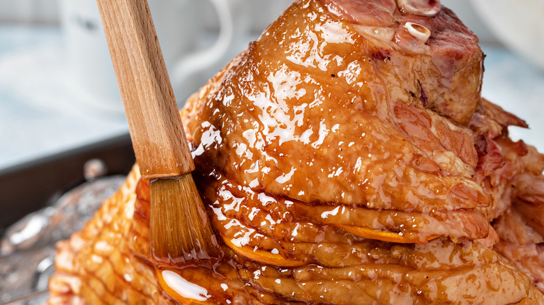 Brushing glaze onto ham