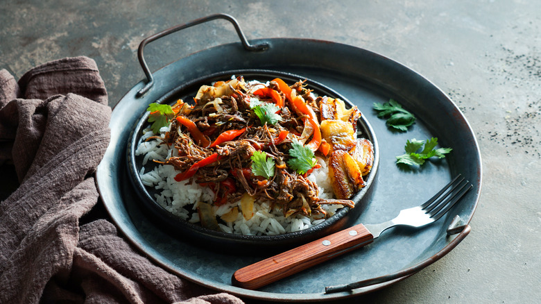 Ropa vieja with fried plantains and rice