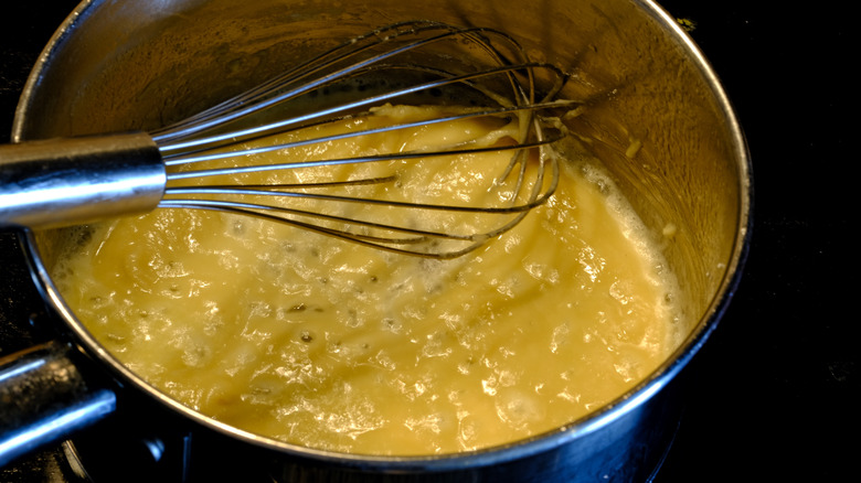 Roux and whisk in pot