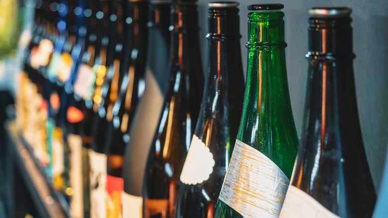 Bottles of sake lined on shelf