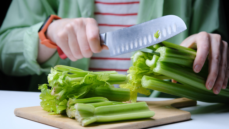 Celery being cut into pieces