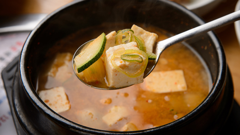 spoonful of doenjang jjigae over bowl