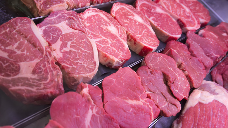 raw steaks on display