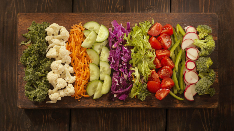 Chopped vegetables on wooden board