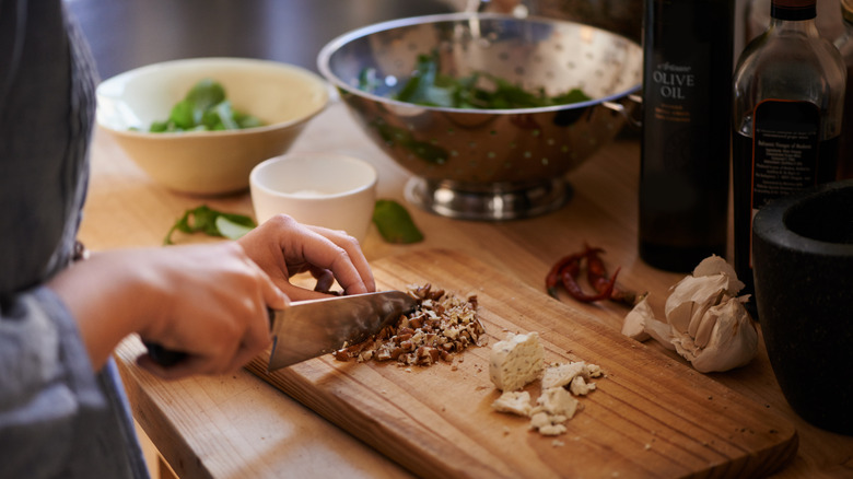 Person chopping nuts