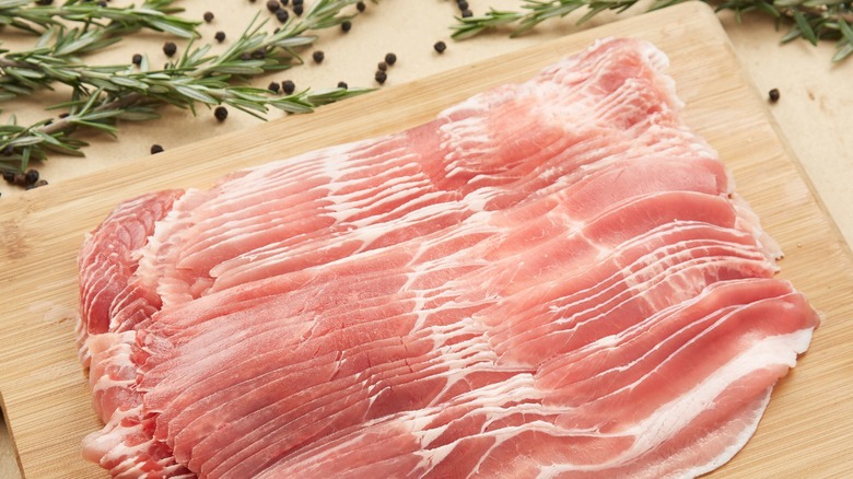 slices of bacon on cutting board