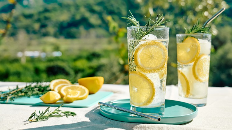 two sparkling lemon drinks on outside table